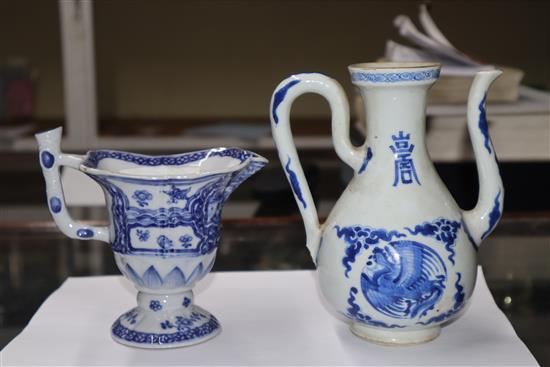 A Chinese Kangxi period blue and white wine pot and a Qianlong period helmet shaped milk jug Height of pot 16cm